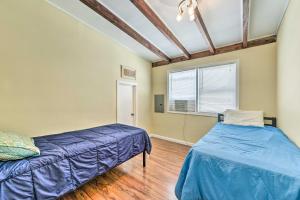 a bedroom with two beds and a window at Sea Isle City Apartment, Close to Beaches! in Sea Isle City