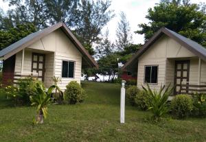 a house with a mailbox in front of it at Tammoyo Place in Kudat