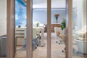 a room with a table and chairs and a bathroom at Legacy Resort Hotel & Spa in San Diego