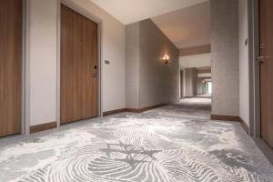a hallway with a zebra pattern on the floor at Legacy Resort Hotel & Spa in San Diego