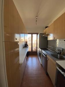 Kuchyň nebo kuchyňský kout v ubytování Appartement avec terrasse