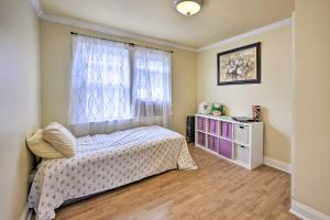 a bedroom with a bed and a window at Charming New York Escape Near Central Park! in Jericho