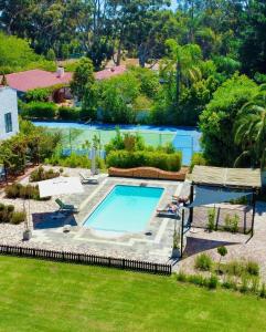 an aerial view of a swimming pool in a yard at Vine Guesthouse in Stellenbosch