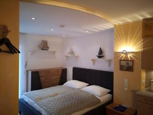 Postel nebo postele na pokoji v ubytování Hotel Wirt Z'Minsta