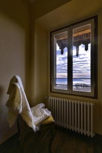 Ένα ή περισσότερα κρεβάτια σε δωμάτιο στο La Villanella - Theater Home