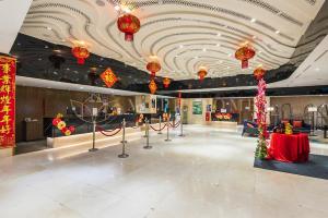 a lobby with red lanterns on the ceiling of a building at Ion Delemon Premier Suites Genting Highlands in Genting Highlands +36 photos