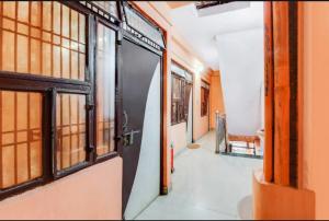 an open door to a room with a hallway at Hotel Radhe Inn By WB Inn in Agra