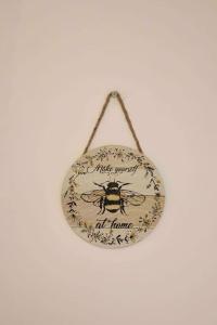 a bag with a bee on it hanging on a wall at Contemporary & Stylish House . FREE Parking in Beeston Hill