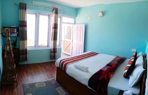 Tempat tidur dalam kamar di Mountain Resort