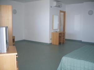 Ένα ή περισσότερα κρεβάτια σε δωμάτιο στο Hotel Soleado