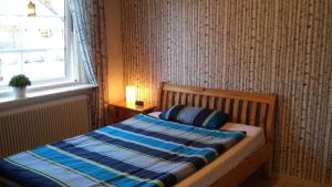 En eller flere senge i et værelse på Villa Elsy