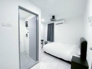 Venice Guest Hostel - Bilik Sahaja客房内的一张或多张床位