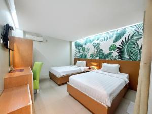 Postel nebo postele na pokoji v ubytování Shinta Guesthouse