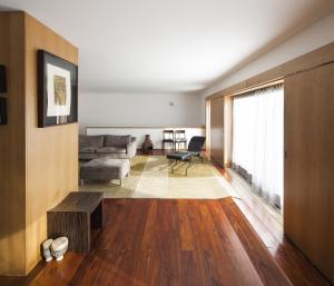 a living room with a couch and a table at Seven Books House in Carrazeda de Anciães