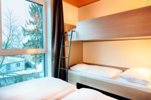 Postel nebo postele na pokoji v ubytování B&B Hotel Bamberg