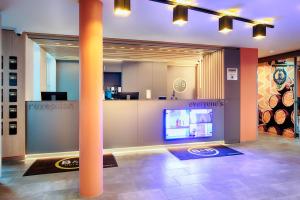 TV a/nebo společenská místnost v ubytování B&B Hotel Bamberg