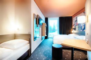 Postel nebo postele na pokoji v ubytování B&B Hotel Bamberg + 35 fotografií