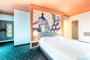 Postel nebo postele na pokoji v ubytování B&B Hotel Bamberg
