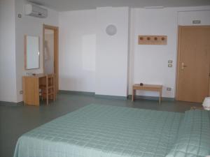 Ένα ή περισσότερα κρεβάτια σε δωμάτιο στο Hotel Soleado