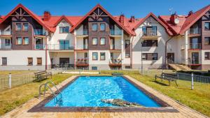 Bazén v ubytování Apartamenty Sun & Snow Lisi Jar - sezonowy basen, blisko plaży, sauna nebo v jeho okolí