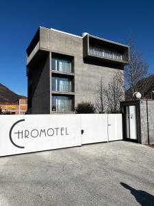 a building with a sign in front of it at Chromotel self check-in in Mezzovico