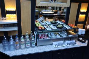 a buffet of food and drinks on a counter at Avenue Hotel in Nuremberg