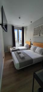 Postel nebo postele na pokoji v ubytování CH Lemon Rooms - Madrid + 10 fotografií