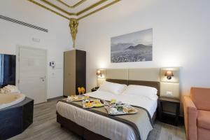 Postel nebo postele na pokoji v ubytování Hotel Palazzo Argenta