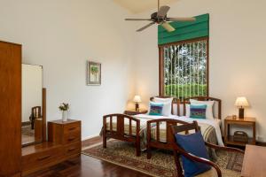 a bedroom with a bed and a window at Jetwing Uva Ben Head Villa in Welimada
