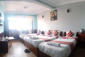 Tempat tidur dalam kamar di Mountain Resort