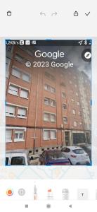 a screenshot of a google building with cars parked in front at Habitaciones en Aviles in Avilés