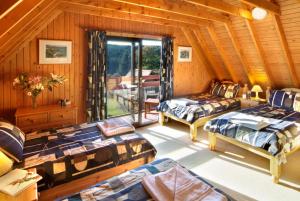 Ένα ή περισσότερα κρεβάτια σε δωμάτιο στο Thistle Lodges at Sandyhills Bay