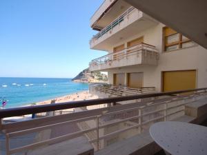 desde el balcón de un edificio con vistas a la playa en LETS HOLIDAYS Beachfront apartment tossa de mar en Tossa de Mar