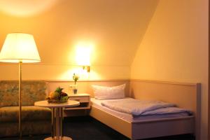 En eller flere senge i et værelse på Hotel Altenwerder Hof