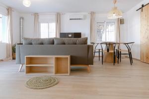 a living room with a couch and a table at Finca de l’Anglés. Levante in Potríes