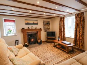 Televiisor ja/või meelelahutuskeskus majutusasutuses The Old Sweet Shop