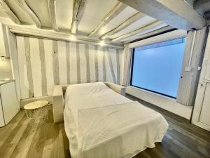 Posteľ alebo postele v izbe v ubytovaní petit studio près du centre - 186