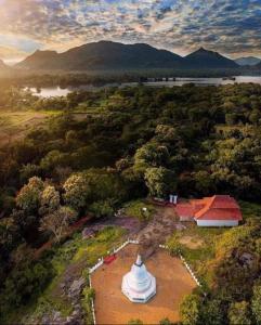 an aerial view of a building in a field at Nageran Homestay in Dambulla