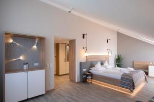 Postel nebo postele na pokoji v ubytování Hotel St. Wolfgang