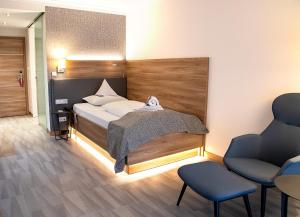Postel nebo postele na pokoji v ubytování Hotel St. Wolfgang