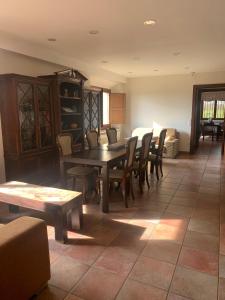 a dining room with a table and chairs at Mas Duc in Brunyola