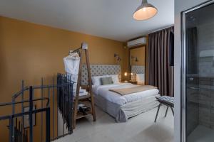 Postel nebo postele na pokoji v ubytování Talbot & Bons Studio Flat