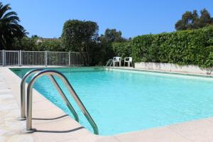 a swimming pool with a slide in the middle at SUQUETTE Charming provencal house in Antibes with nice terrace, garden and pool access in Antibes