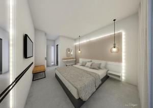 1 dormitorio con 1 cama grande en una habitación en Atlantis Boutique City Hotel, en Rodas