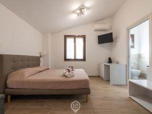 Ένα ή περισσότερα κρεβάτια σε δωμάτιο στο Villa Monica