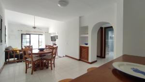 a kitchen and dining room with a table and chairs at Casa Margarita in Tías