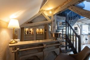 a room with a staircase with a wine tasting room at Proche Châteaux et Beauval : La Villa Eribelle avec piscine in Romorantin +27 photos
