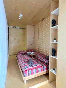 A bed or beds in a room at Flower house 5