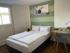 Postel nebo postele na pokoji v ubytování Residenz Hotel Wuppertal