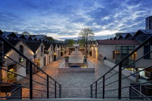 a brick street with a fountain in the middle at Hotel La Petite Rosa in Paris